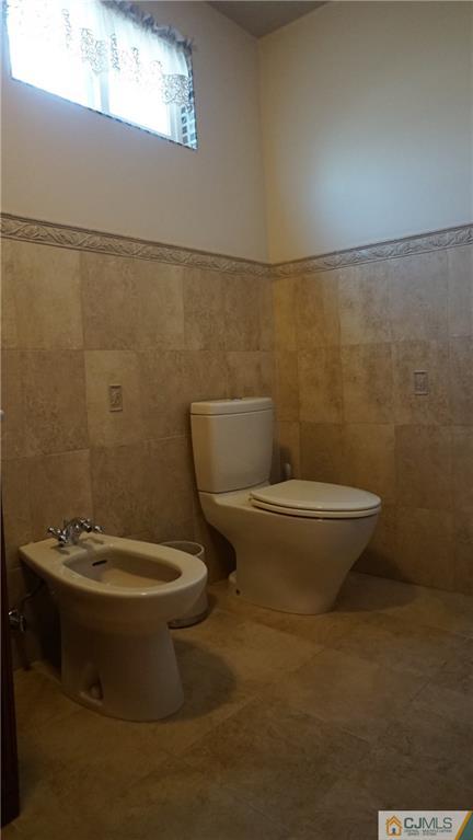8 Plumstead Road Sewell, NJ 08080 - Photo 20 of 25 a white toilet sitting next to a bathroom sink
