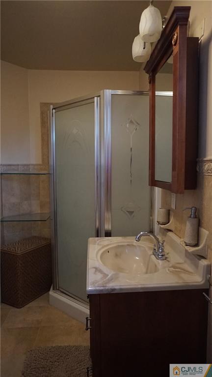 8 Plumstead Road Sewell, NJ 08080 - Photo 21 of 25 a bathroom with a sink and a mirror