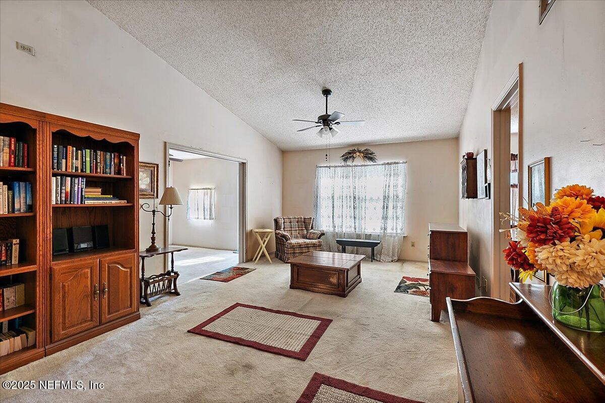 3608 Chappi Way Jacksonville, FL 32223 - Photo 6 of 14 a living room with furniture and a flat screen tv