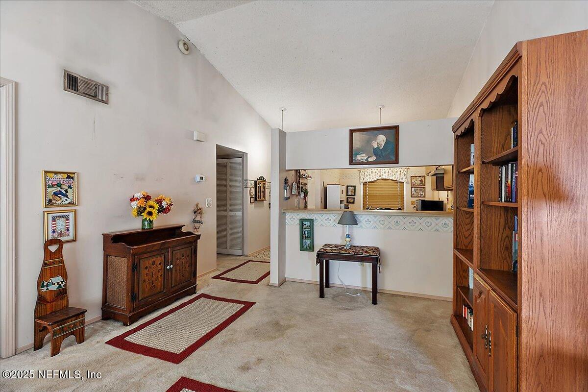 3608 Chappi Way Jacksonville, FL 32223 - Photo 7 of 14 a living room with furniture and a flat screen tv