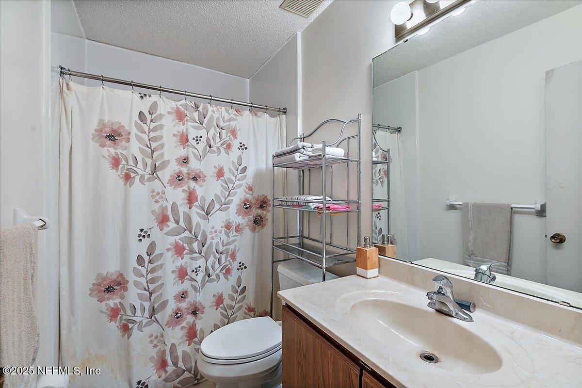 3608 Chappi Way Jacksonville, FL 32223 - Photo 10 of 14 a bathroom with a sink toilet and shower