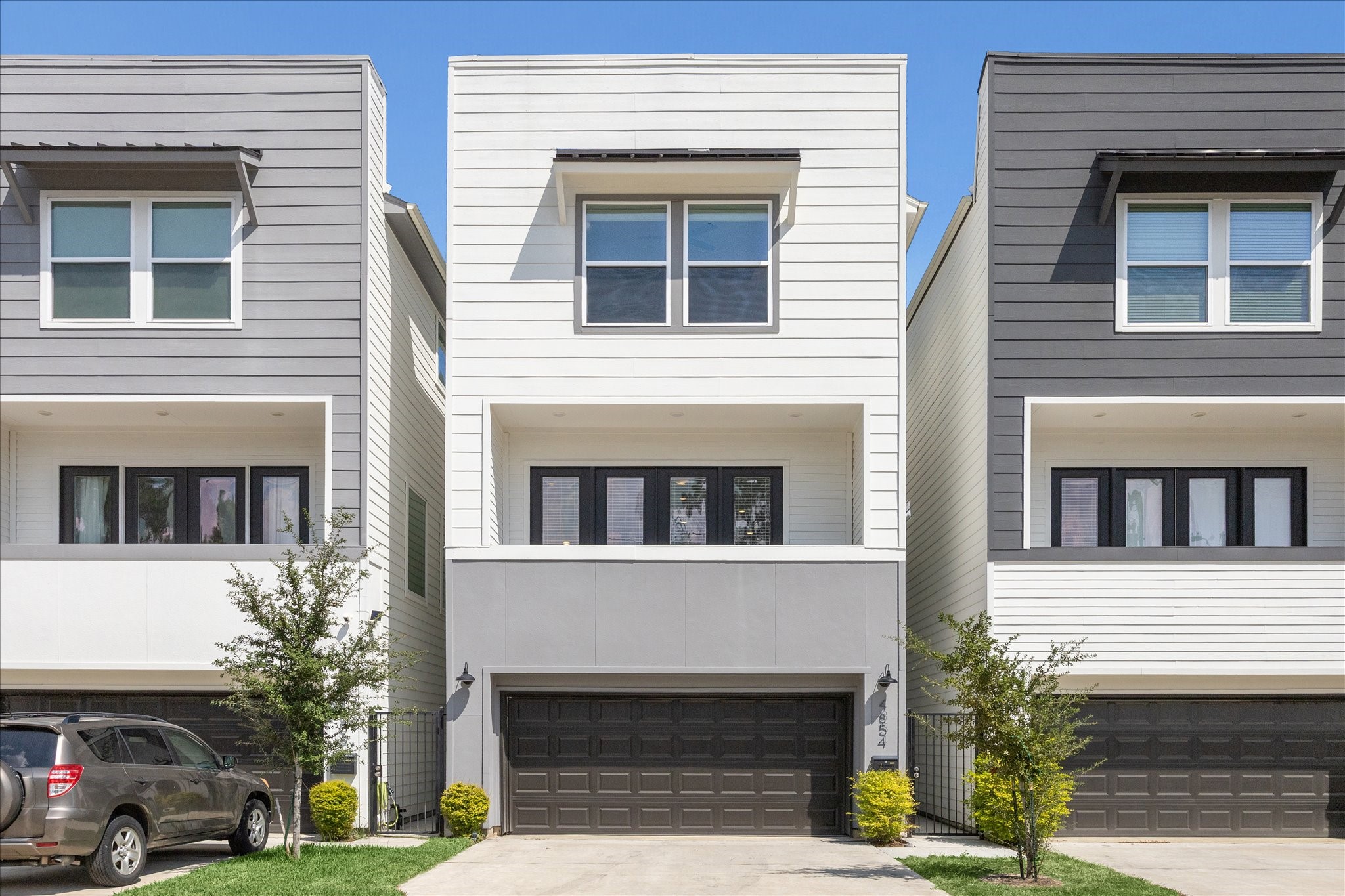 Welcome to 4854 Brinkman St, a 3-bedroom modern home in the Shepherd Park Plaza area with sleek design, spacious balcony, and a two-car garage.