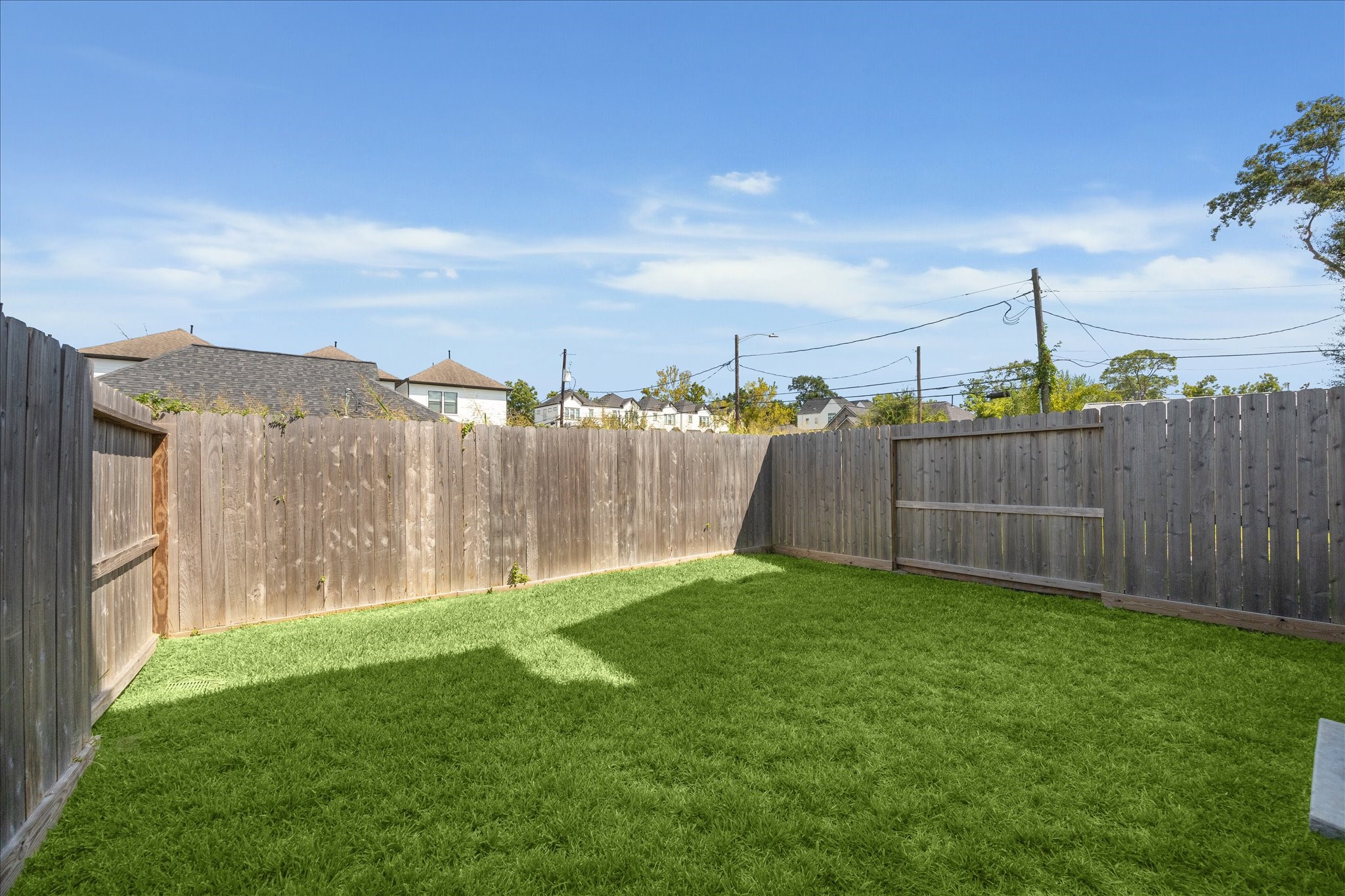 4854 Brinkman Street Houston, TX 77018 - Photo 26 of 30 This additional perspective of the backyard emphasizes the spacious layout, great for play, pets, or gatherings.