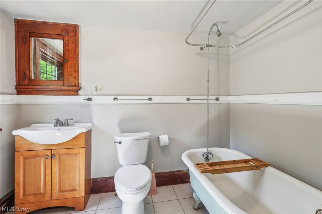 2329 Stillman Road Cleveland, OH 44118 - Photo 40 of 49 Bathroom featuring toilet, tile floors, and large vanity