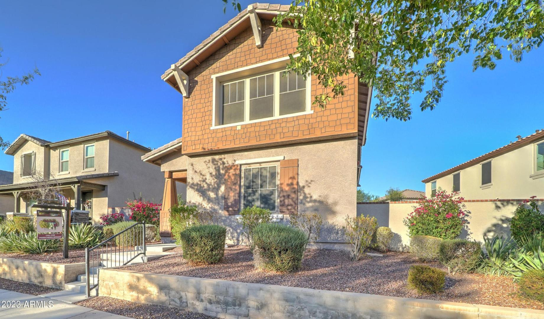 2297 North Alsap Road Buckeye, AZ 85396 - Photo 3 of 36 a front view of a house with garden