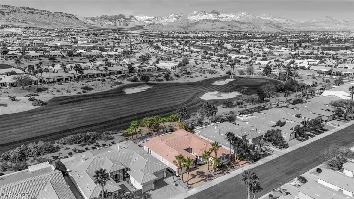 5015 Rivedro Street Las Vegas, NV 89135 - Photo 68 of 91 Overlooking a verdant golf course, this residence offers tranquil living with distant mountain vistas.
