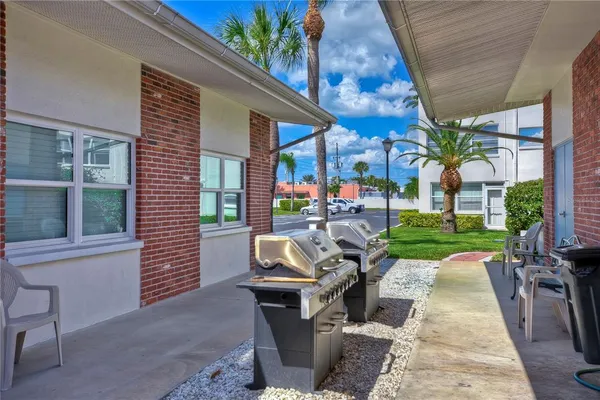 a view of a patio with chairs and tables