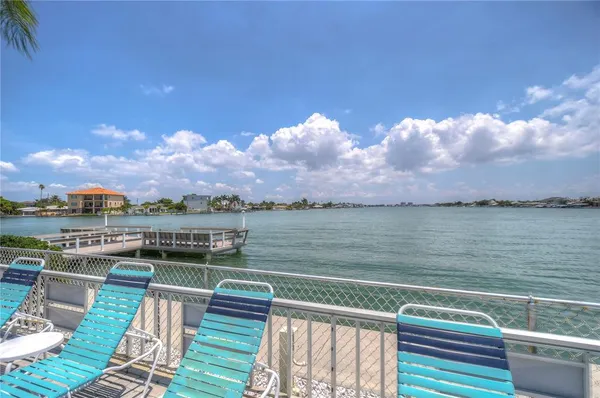 an aerial view of a residential houses with outdoor space