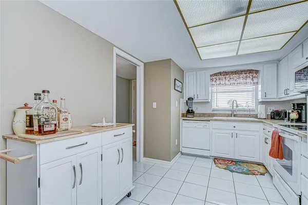 a kitchen with a cabinets and window