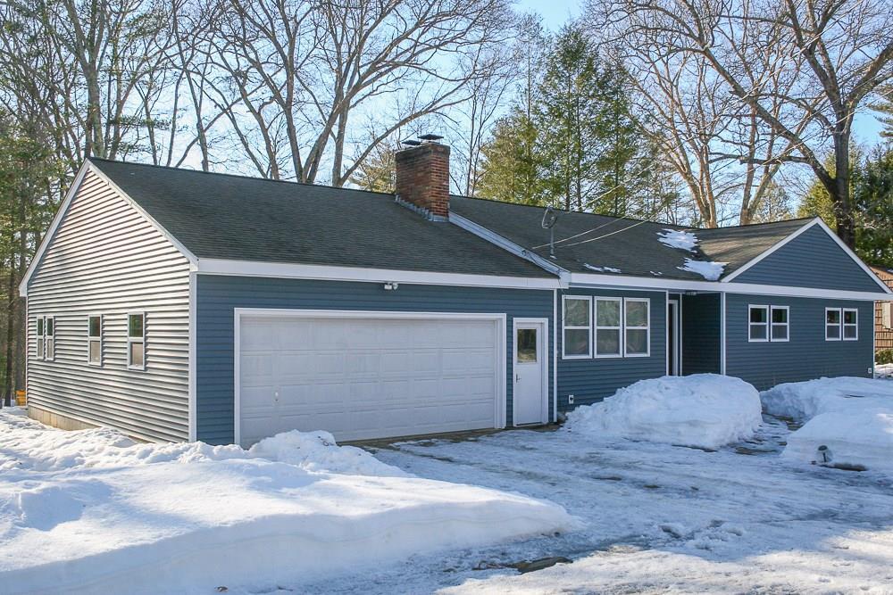 215 Gorman Road Brooklyn, CT 06234 - Photo 1 of 1 a front view of a house with a yard and garage