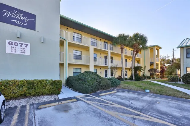 a view of a street with a building in the background