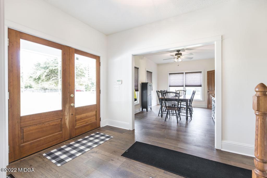 911 Lassiter Road Forsyth, GA 31029 - Photo 19 of 55 a living room with furniture and a large window