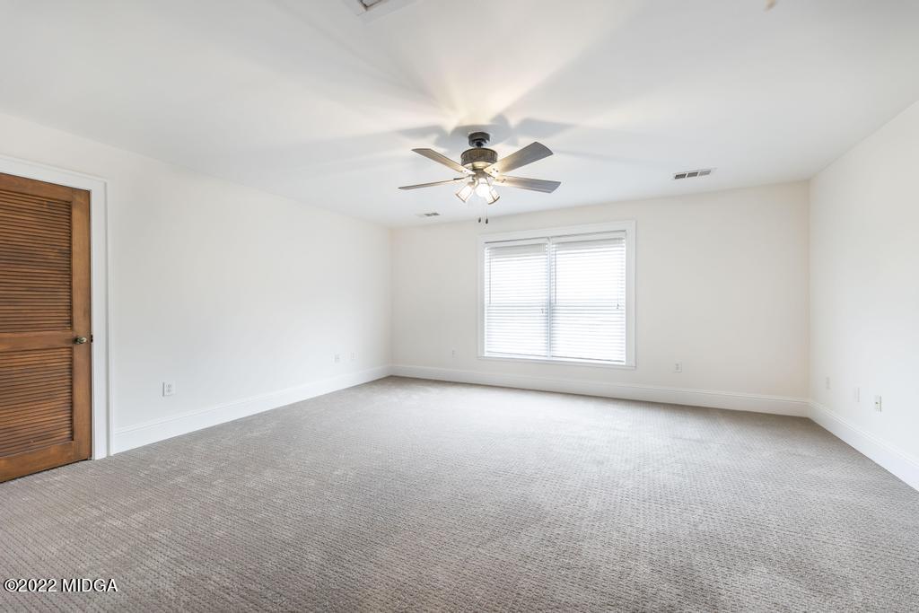 911 Lassiter Road Forsyth, GA 31029 - Photo 40 of 55 wooden floor in an empty room with a window
