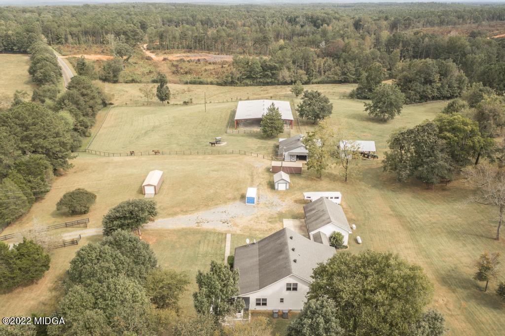 911 Lassiter Road Forsyth, GA 31029 - Photo 7 of 55 an aerial view of residential houses with outdoor space