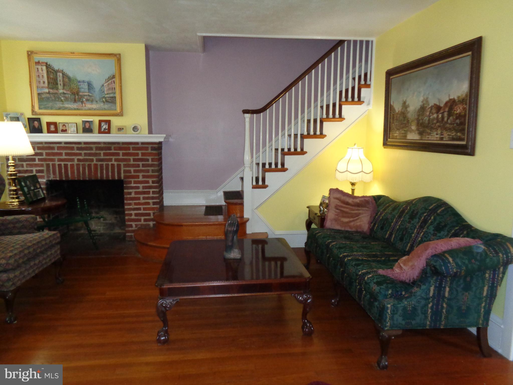 130 Gladstone Road Lansdowne, PA 19050 - Photo 7 of 34 Livingroom, fireplace, and stairs