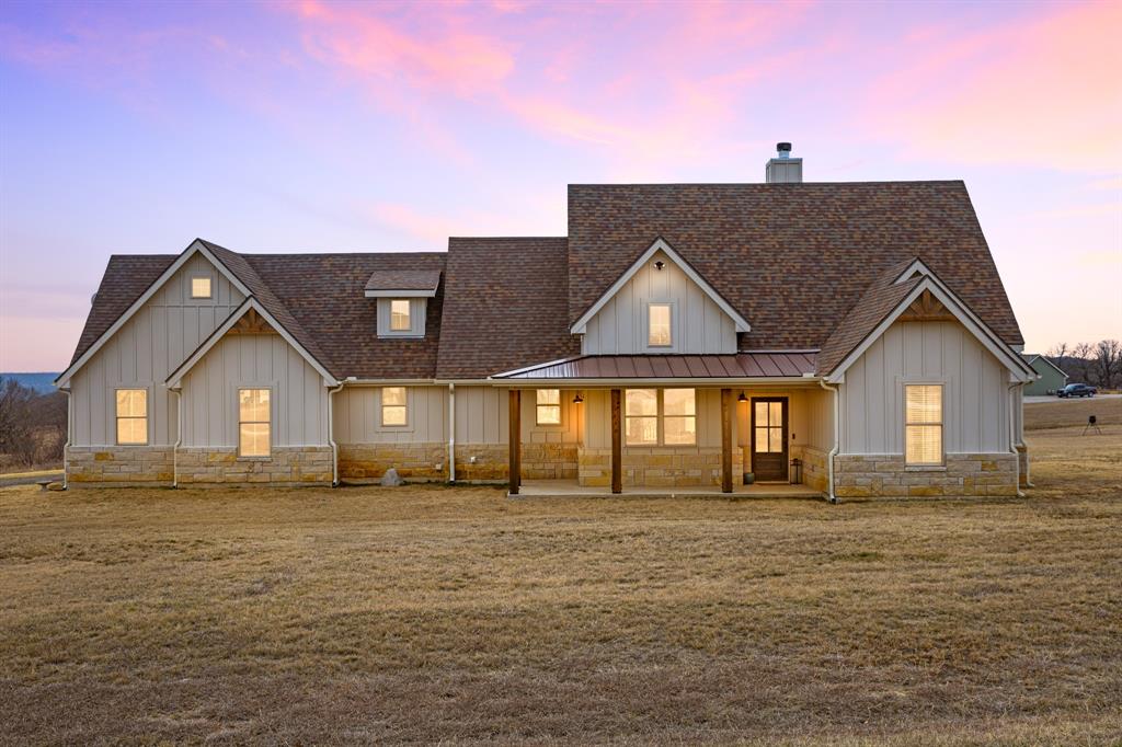 a front door view of a house with a yard