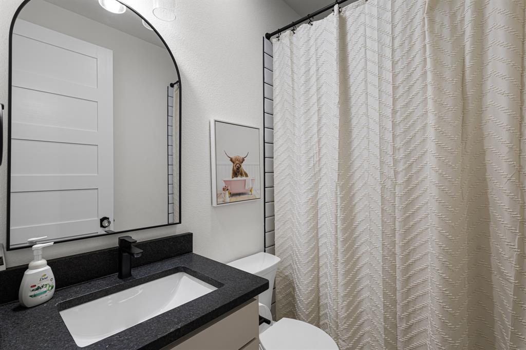 476 Silverleaf Drive Sunset, TX 76270 - Photo 18 of 40 a bathroom with a sink and a mirror