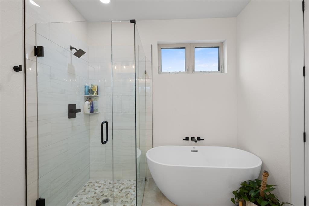 476 Silverleaf Drive Sunset, TX 76270 - Photo 23 of 40 a white bath tub sitting next to a white sink