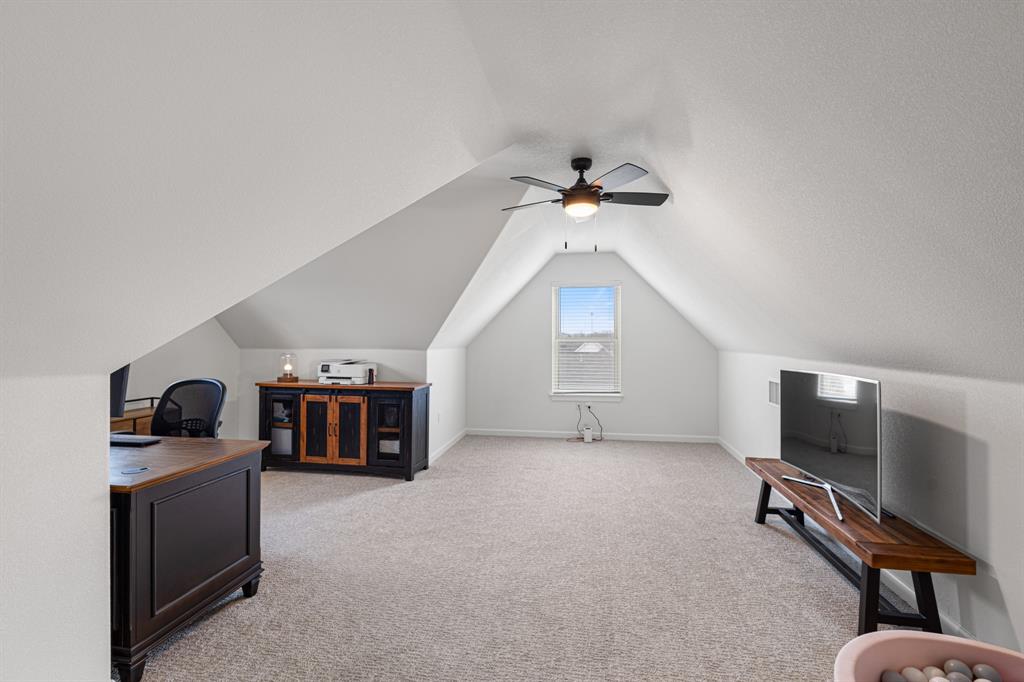 476 Silverleaf Drive Sunset, TX 76270 - Photo 28 of 40 a living room with furniture and a flat screen tv
