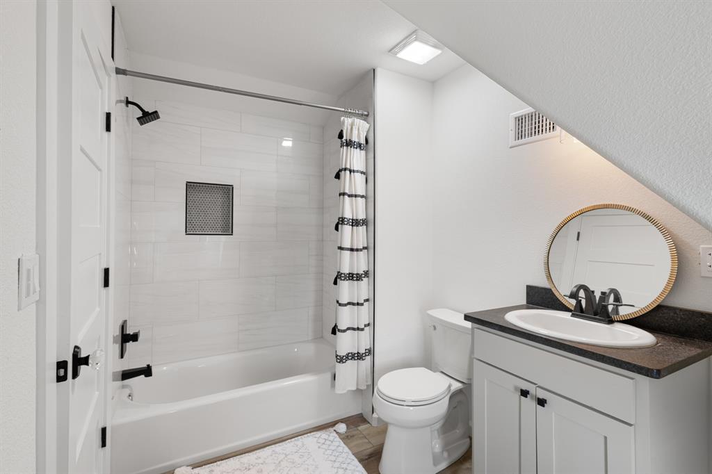 476 Silverleaf Drive Sunset, TX 76270 - Photo 30 of 40 a bathroom with a sink toilet and shower