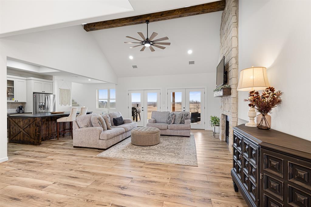 476 Silverleaf Drive Sunset, TX 76270 - Photo 6 of 40 a living room with furniture and a chandelier