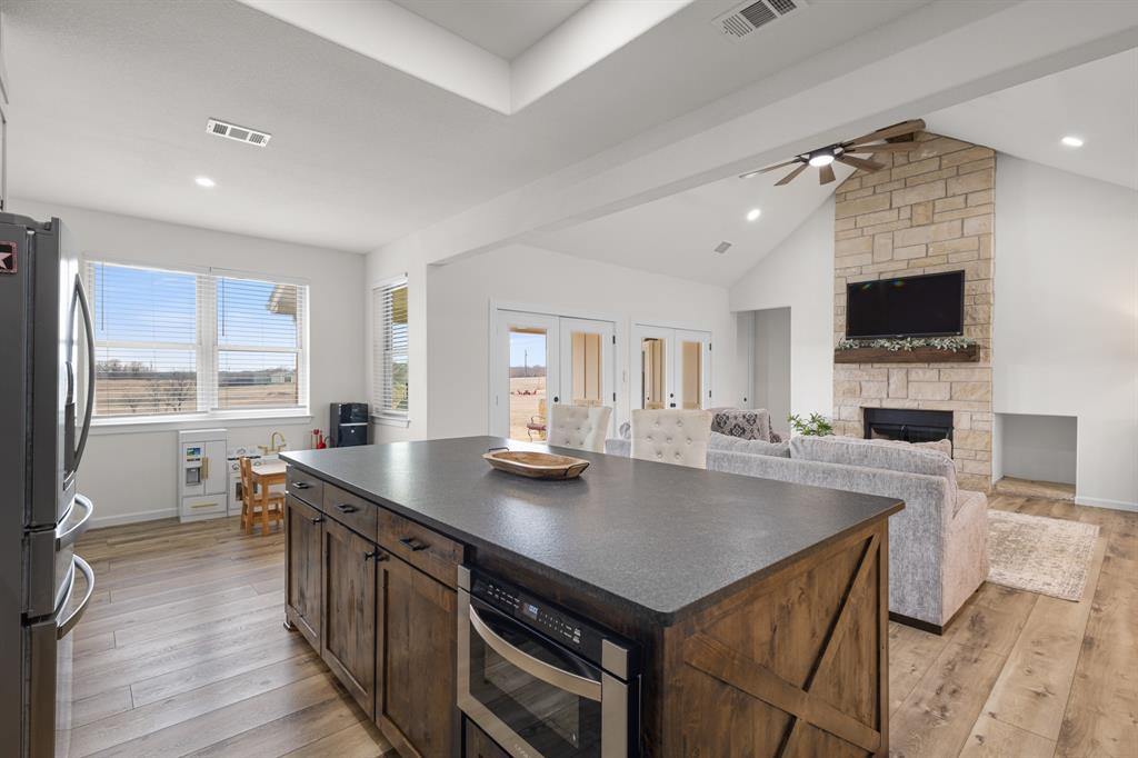 476 Silverleaf Drive Sunset, TX 76270 - Photo 10 of 40 a kitchen with sink stove and refrigerator
