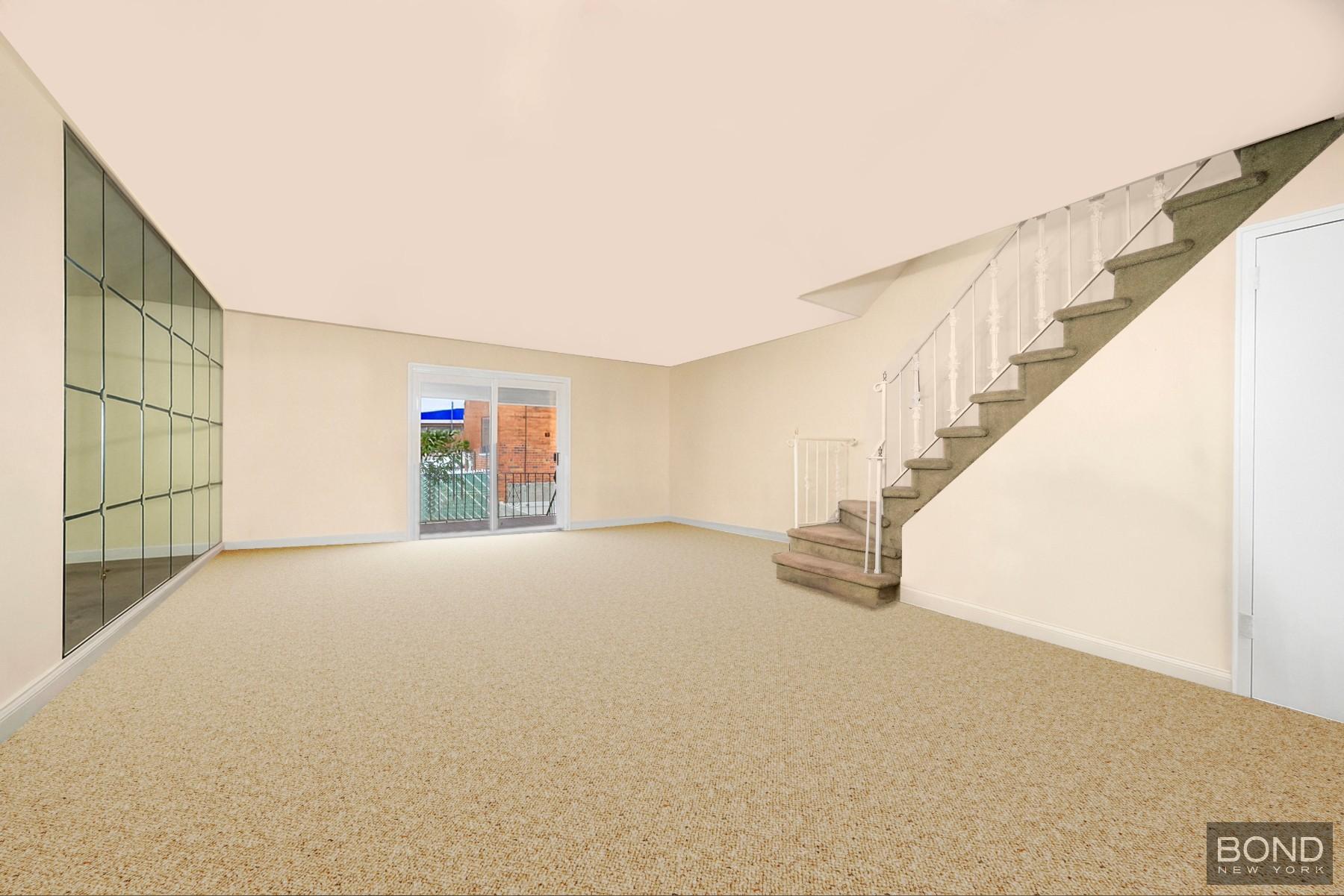 69-01 61st Road Queens, NY 11379 - Photo 3 of 9 a view of an empty room with stairs