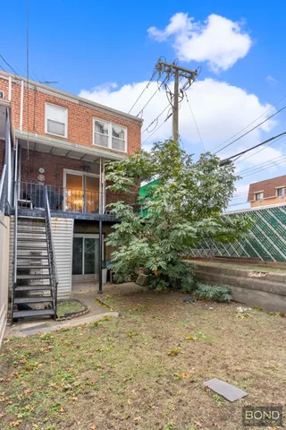 a view of a house with brick walls