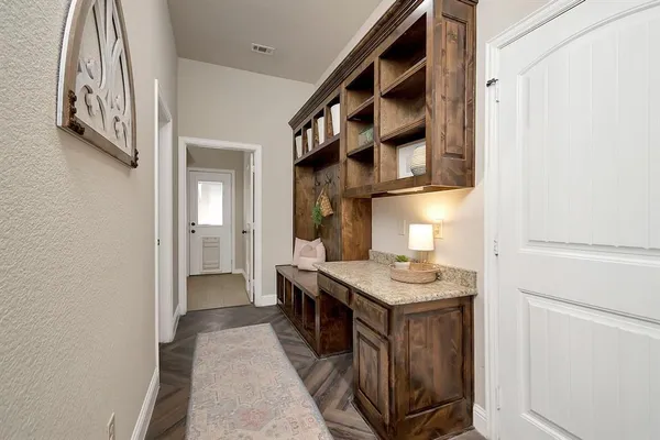 a kitchen with stainless steel appliances granite countertop a stove and a refrigerator