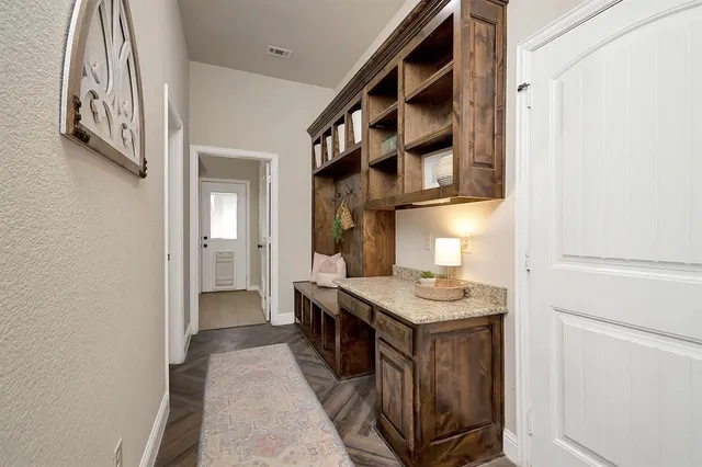 a kitchen with stainless steel appliances granite countertop a stove and a refrigerator