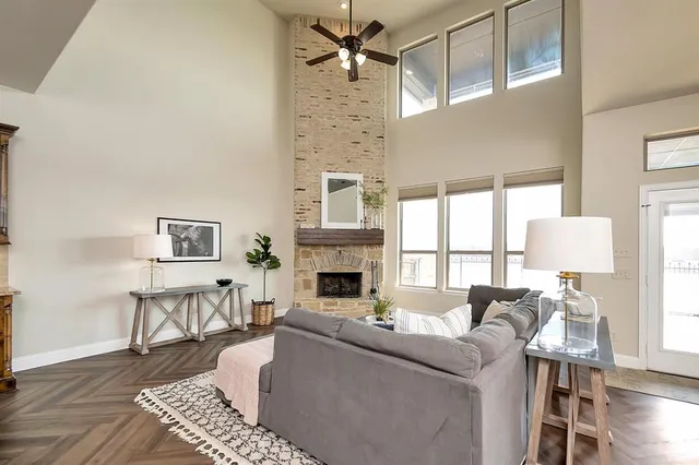 a living room with furniture a fireplace and a table