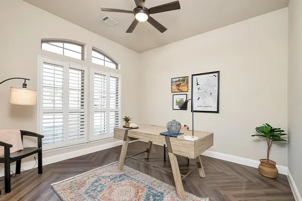 a workspace with furniture and a window