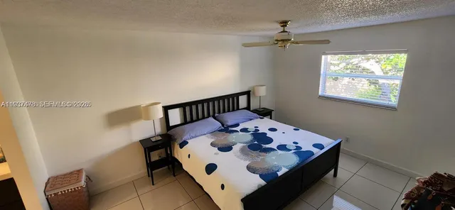 a bathroom with a glass door shower