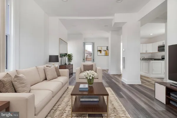 a living room with furniture fireplace and flat screen tv