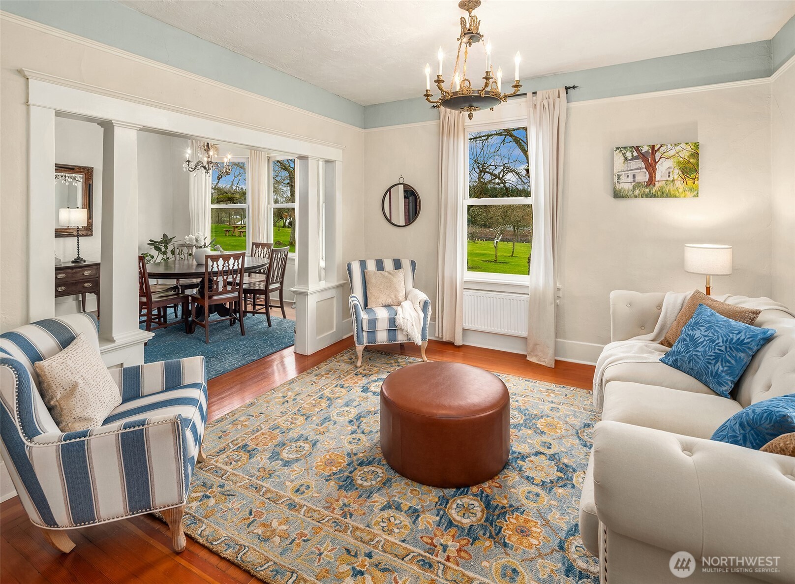 6007 Southwest 240th Street Vashon, WA 98070 - Photo 13 of 40 a living room with furniture a window and a chandelier