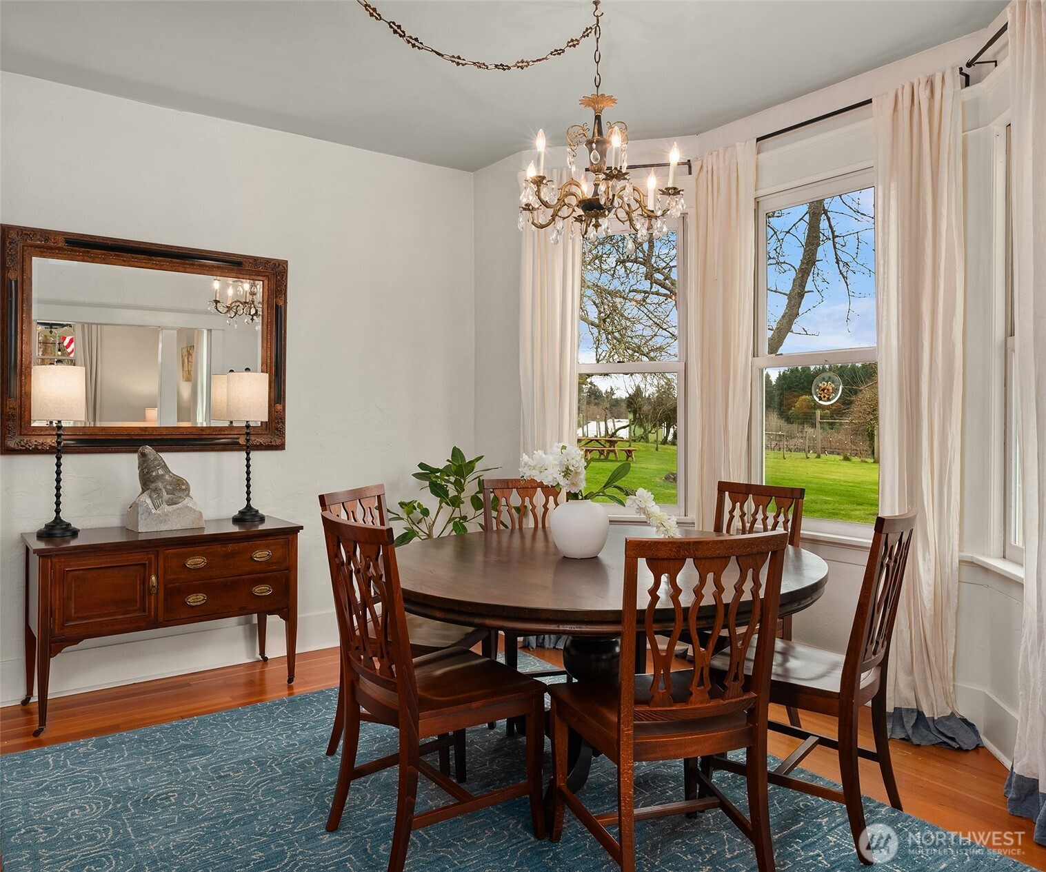 6007 Southwest 240th Street Vashon, WA 98070 - Photo 14 of 40 a view of a dining room with furniture window and outside view