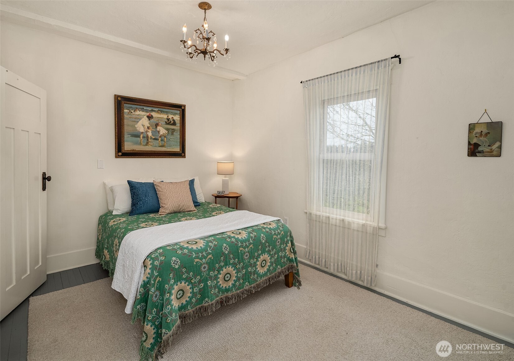 6007 Southwest 240th Street Vashon, WA 98070 - Photo 19 of 40 a bedroom with bed and a window