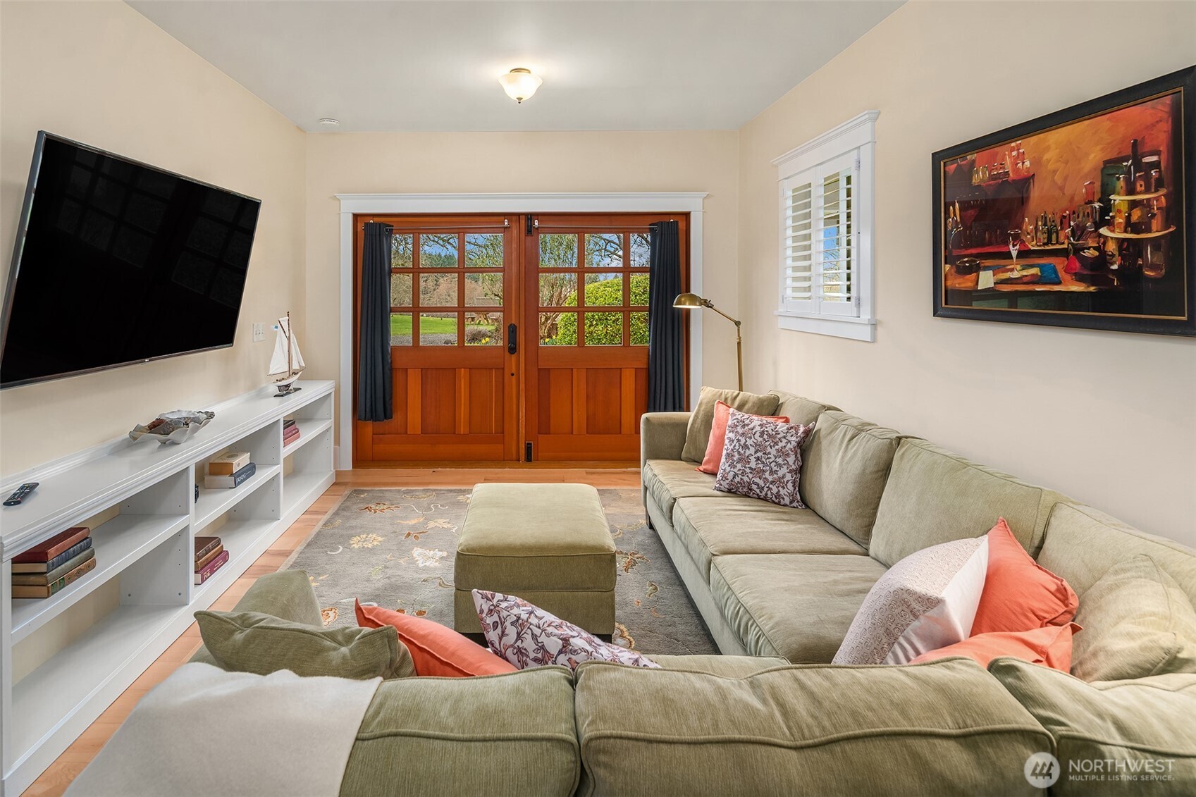 6007 Southwest 240th Street Vashon, WA 98070 - Photo 26 of 40 a living room with furniture and a flat screen tv