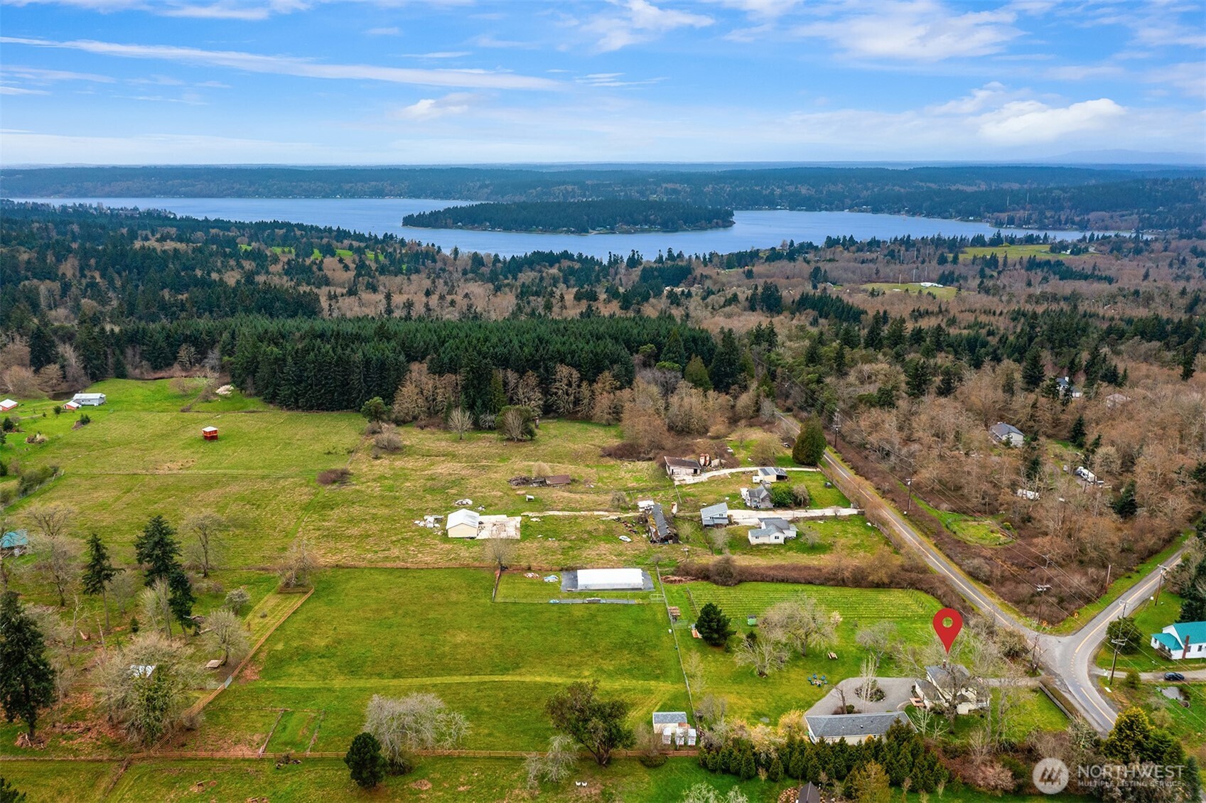 6007 Southwest 240th Street Vashon, WA 98070 - Photo 30 of 40 a view of a lake with a city