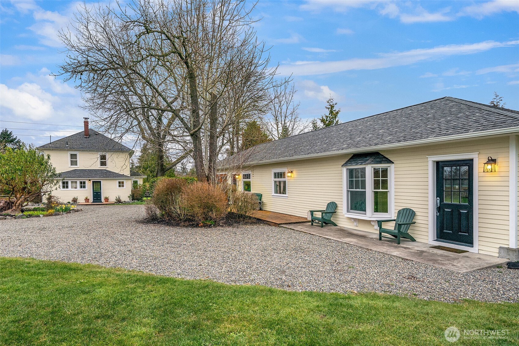 6007 Southwest 240th Street Vashon, WA 98070 - Photo 5 of 40 a view of a house with backyard and a tree