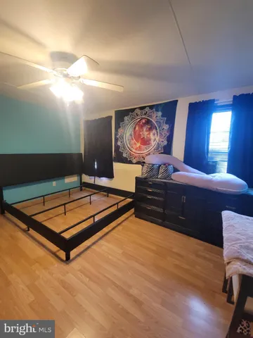 a room with furniture projector and screen