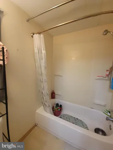 a bathroom with a sink and a shower