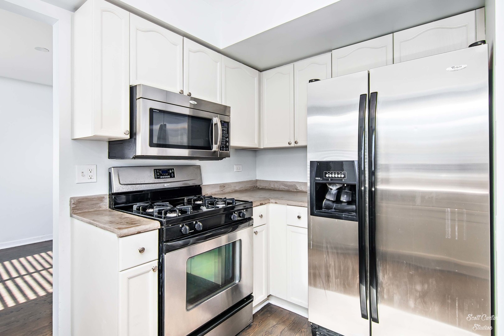 225 Sierra Trail Cary, IL 60013 - Photo 12 of 23 a kitchen with cabinets stainless steel appliances and a counter top space