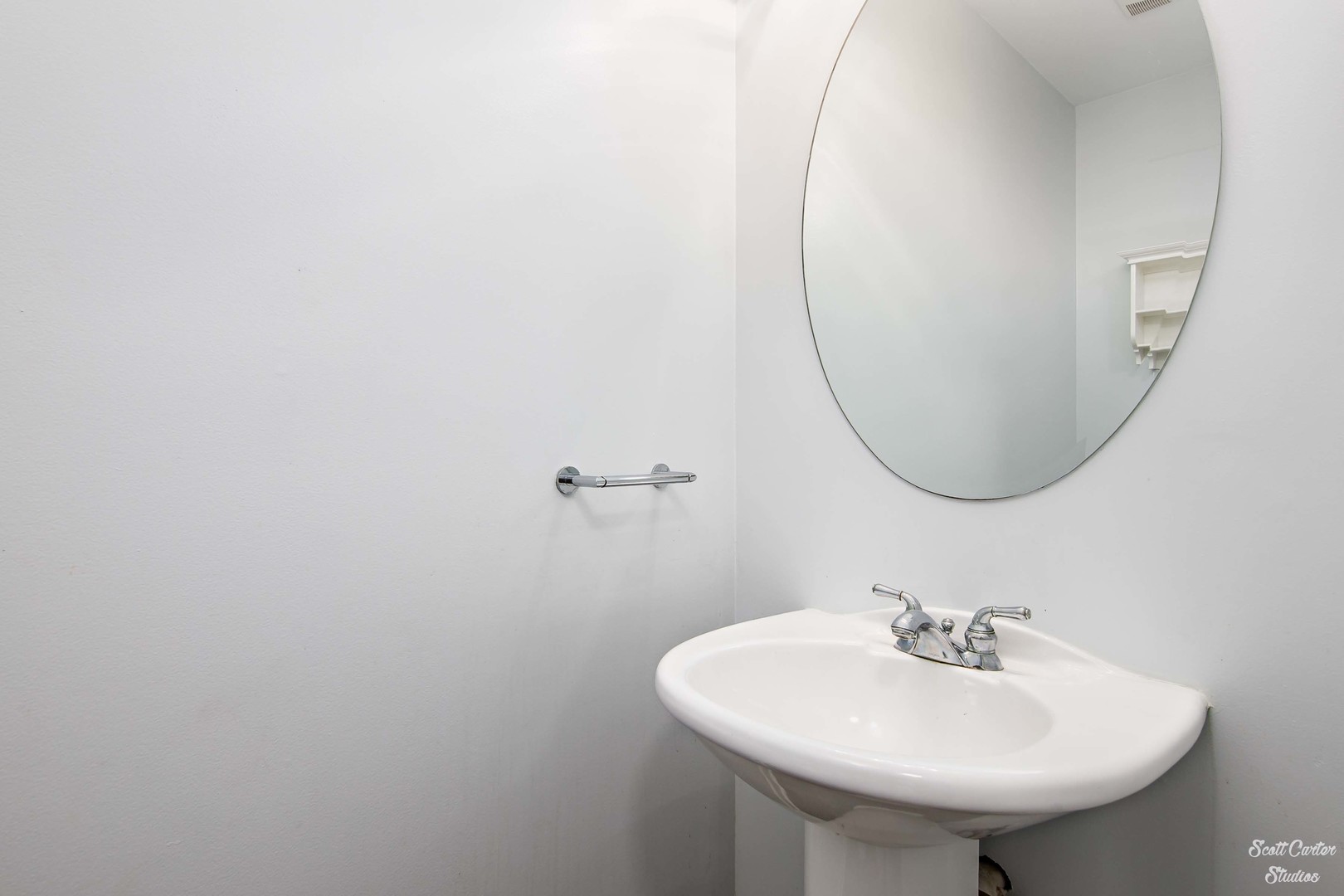 225 Sierra Trail Cary, IL 60013 - Photo 17 of 23 a bathroom with a sink a mirror and a toilet