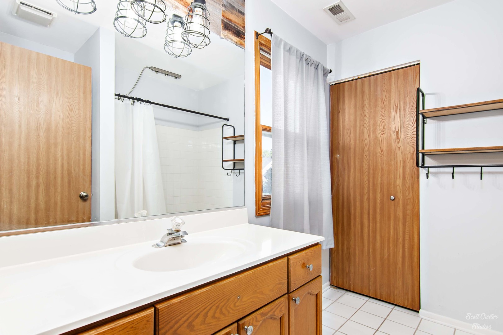 225 Sierra Trail Cary, IL 60013 - Photo 22 of 23 a bathroom with a sink and a mirror