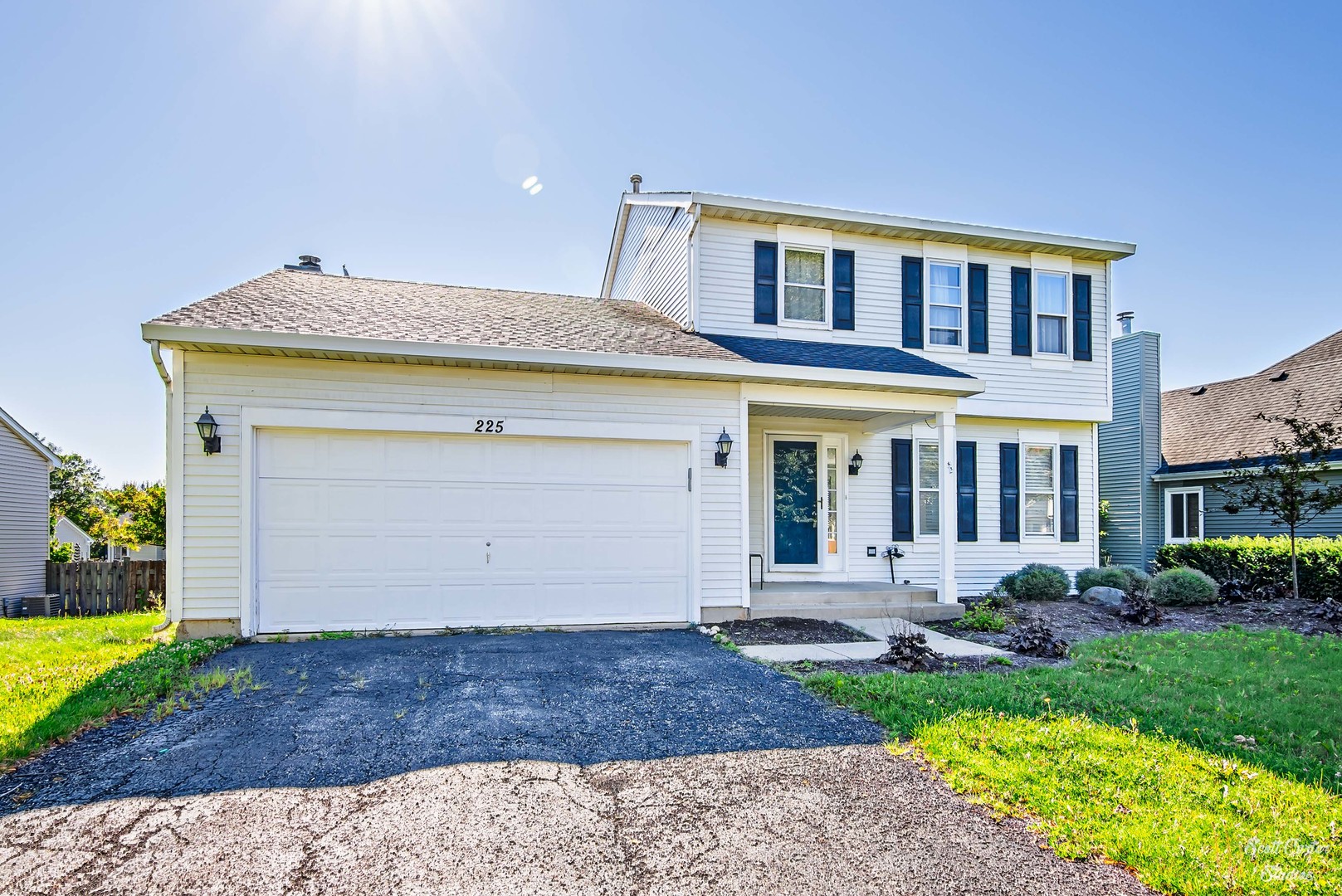225 Sierra Trail Cary, IL 60013 - Photo 4 of 23 a front view of a house with garden