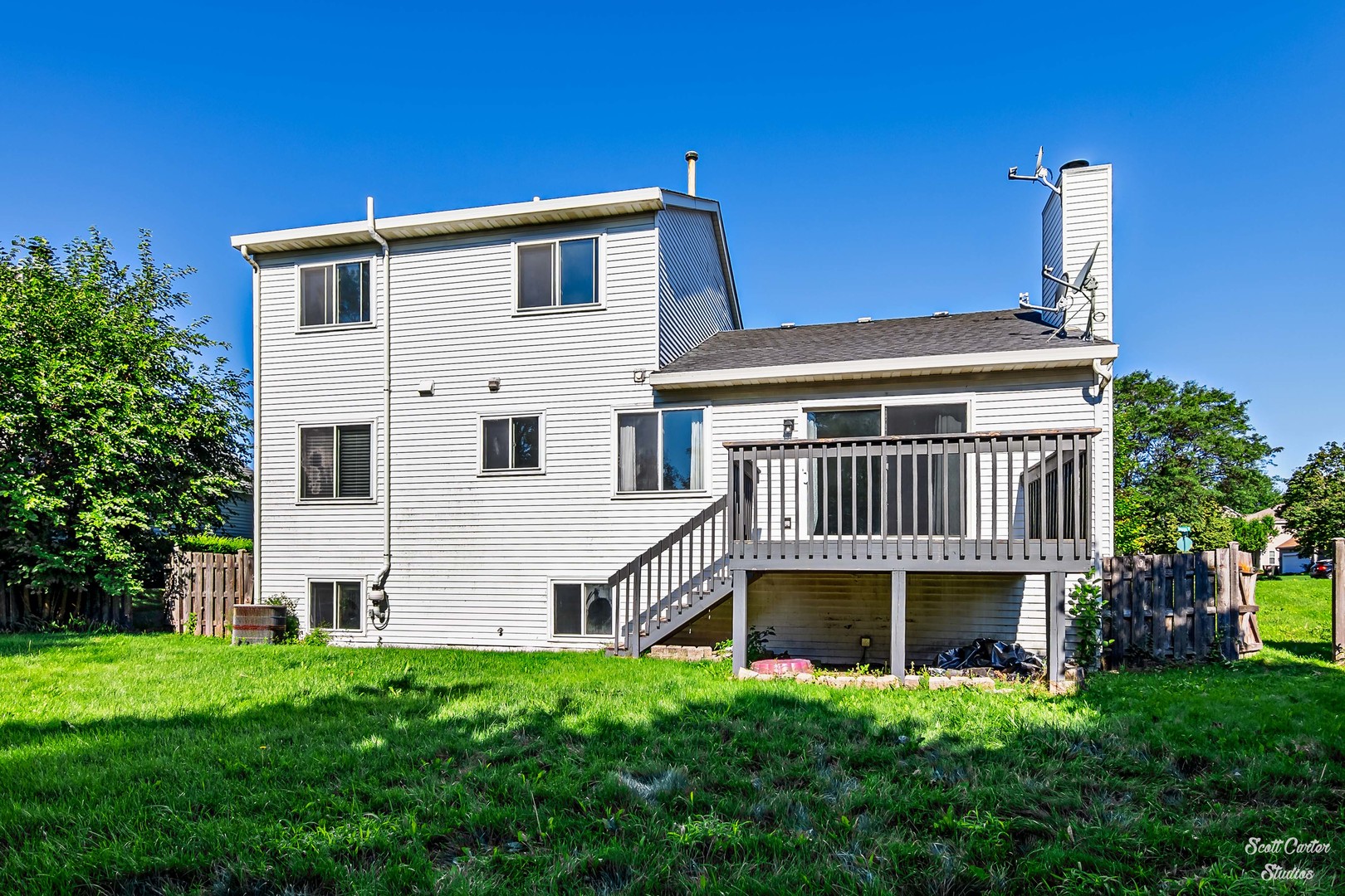 225 Sierra Trail Cary, IL 60013 - Photo 5 of 23 a view of backyard with deck and garden
