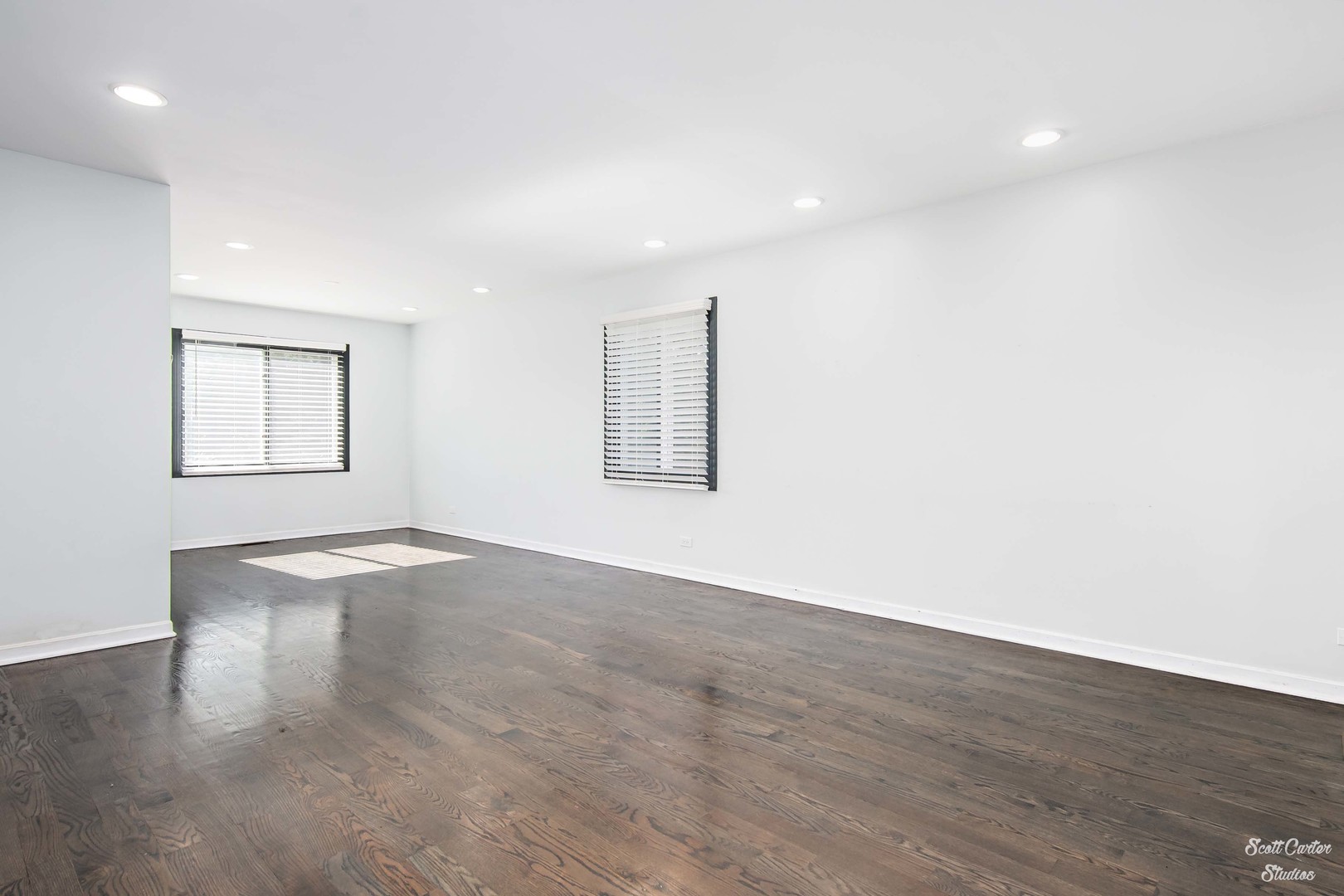 225 Sierra Trail Cary, IL 60013 - Photo 8 of 23 an empty room with wooden floor and windows