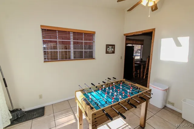 a room that has a bed and a table in it