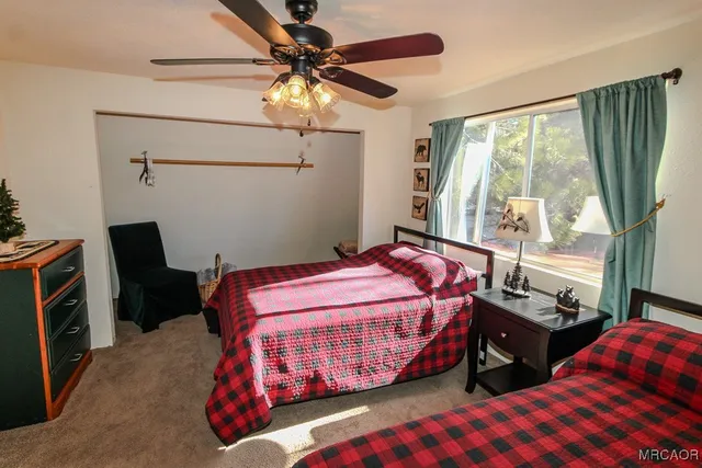 a bedroom with bed and a window